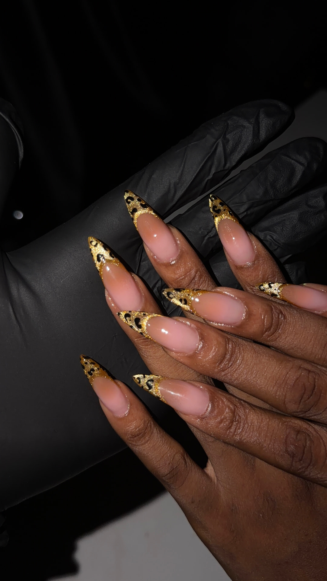 Nude nails with gold glitter leopard french tips
