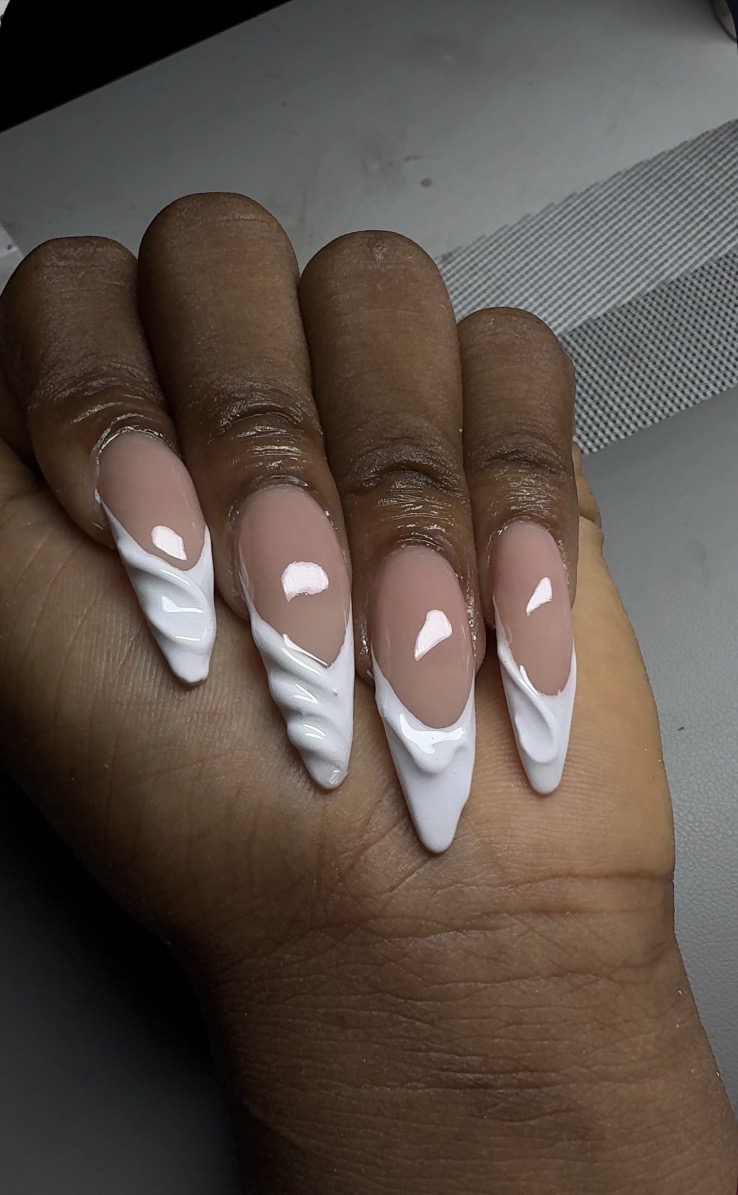 Long stiletto nails with white 3D swirl french tips